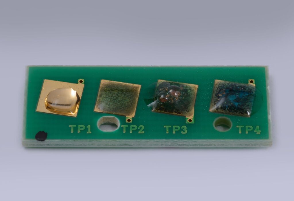 Aqua regia at different concentrations react with gold plated contacts on a printed circuit board