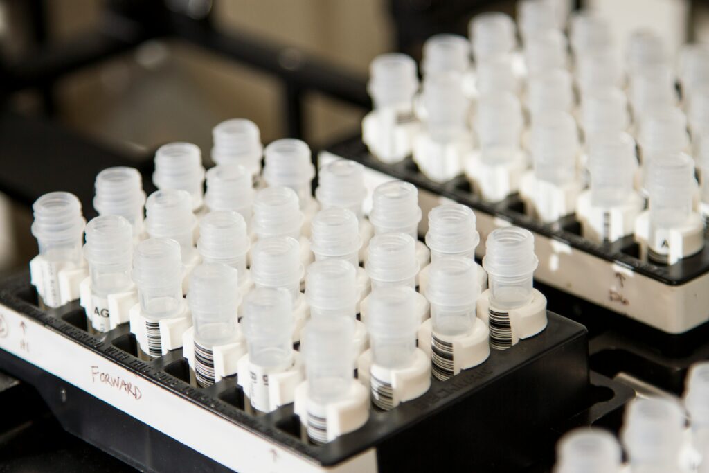 Close-up of trays with eppendorf screwcap vials in a lab setting.